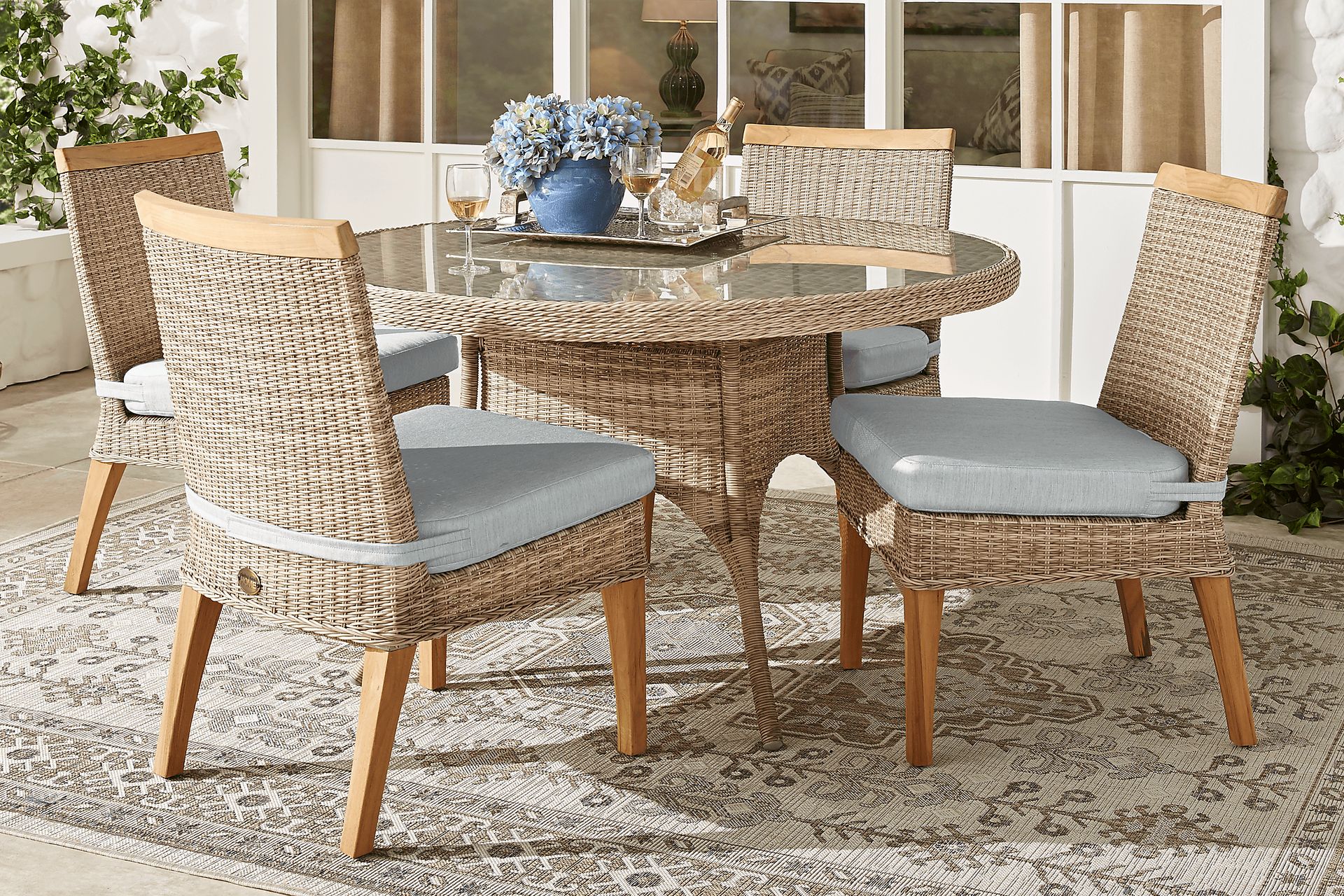 Cindy Crawford Home Hamptons Cove Gray 5 Pc Round Outdoor Dining Set with Rollo Seafoam Cushions - Image 1
