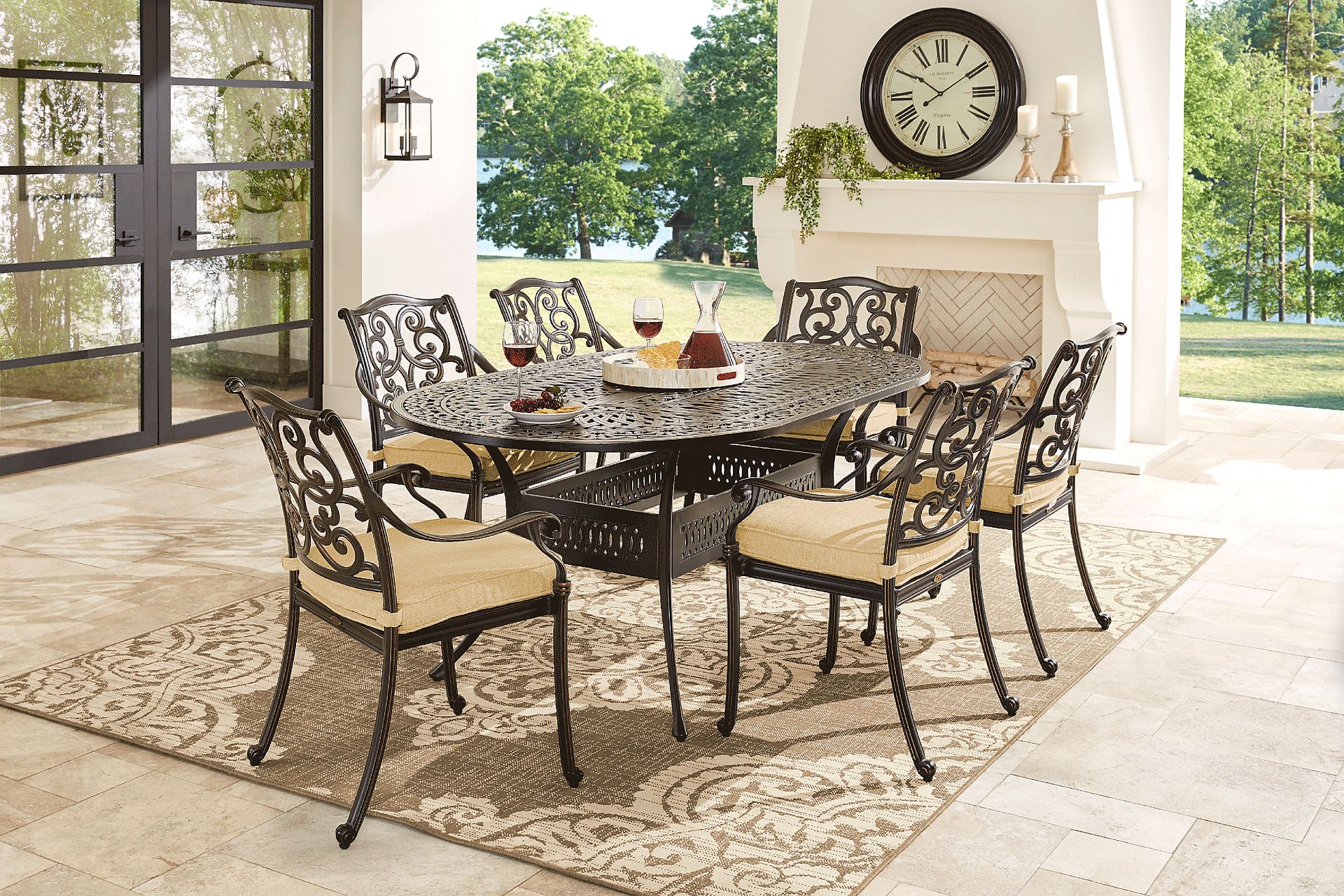 Cindy Crawford Home Lake Como Antique Bronze 7 Pc Oval Outdoor Dining Set with Gold Cushions - Image 1