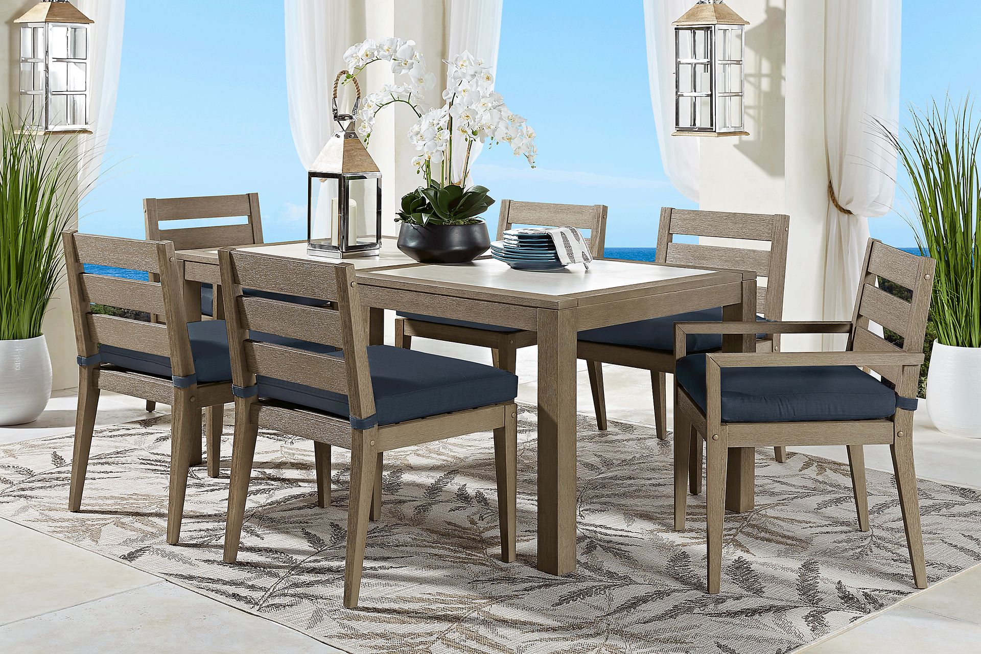 Lake Tahoe Gray 7 Pc Rectangle Outdoor Dining Set with Indigo Cushions - Image 1