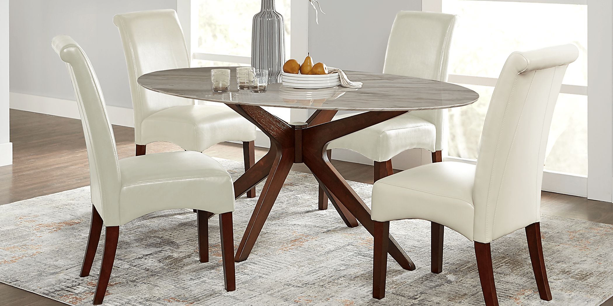 Delmon White 5 Pc Oval Dining Set with Ivory Chairs Rooms To Go