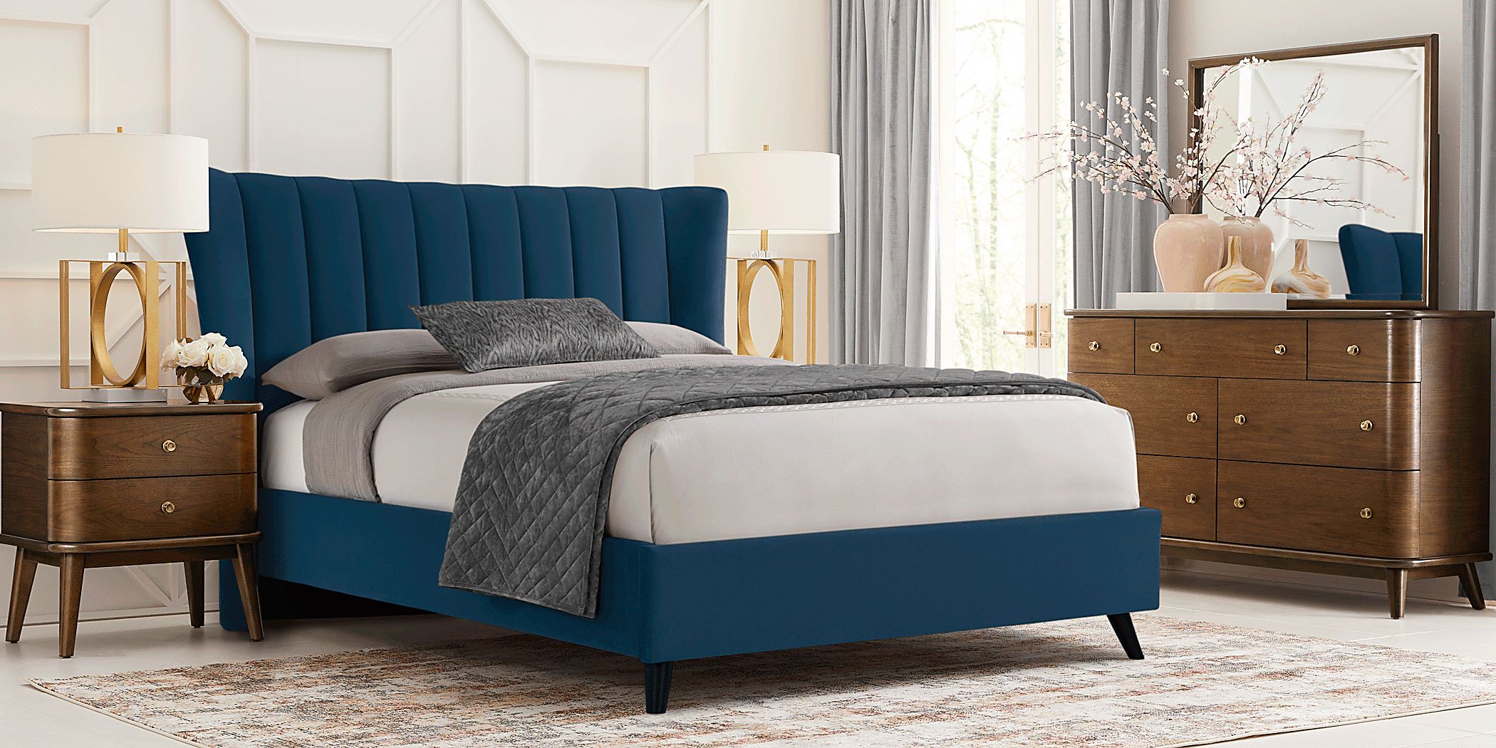 https://assets.roomstogo.com/product/devon-loft-walnut-5-pc-bedroom-with-nanton-park-blue-king-upholstered-bed_8017784P_image-room?cache-id=9ff30f27f9dee165f3f8bc315a047761