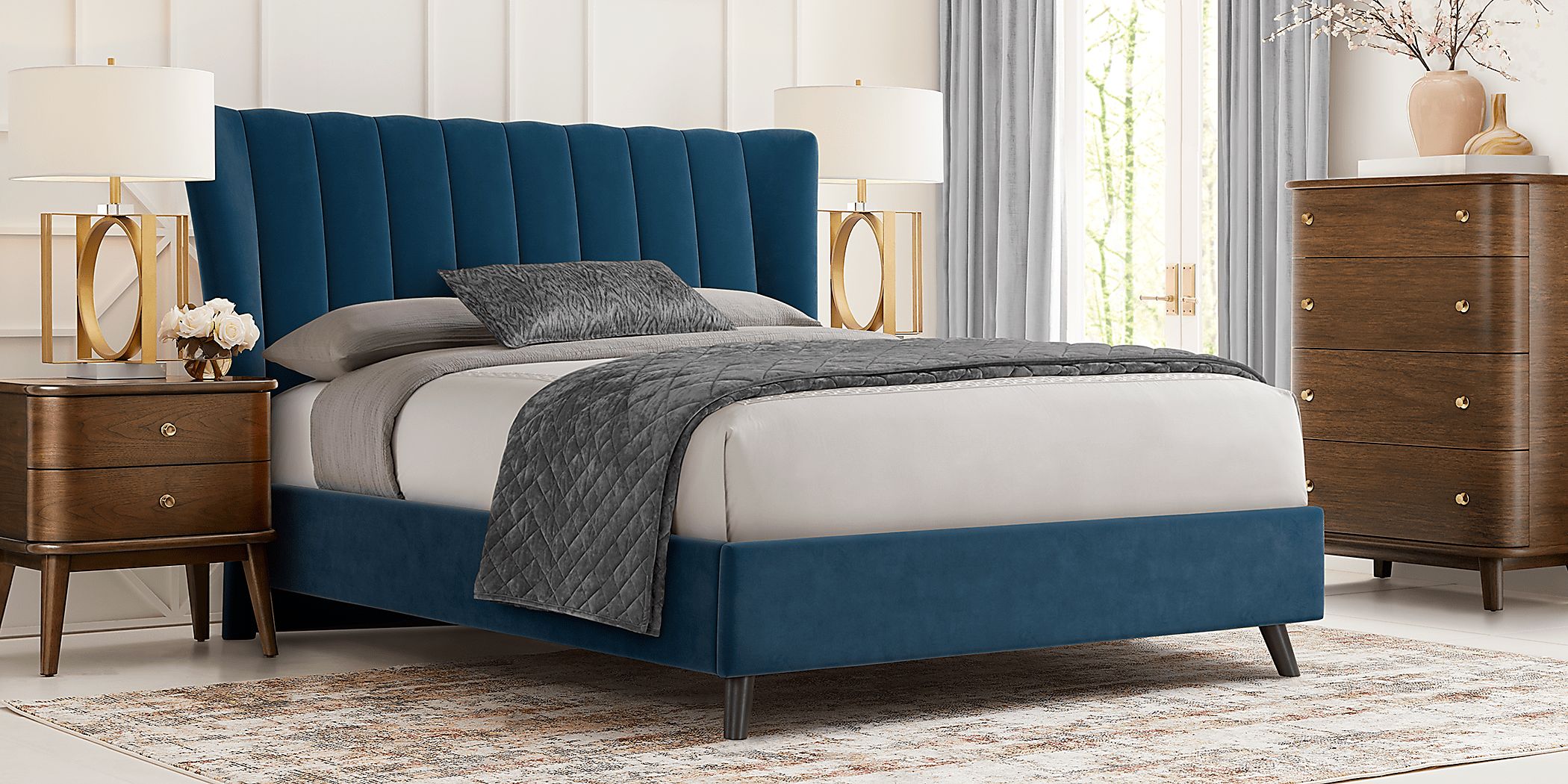 https://assets.roomstogo.com/product/devon-loft-walnut-5-pc-bedroom-with-nanton-park-blue-king-upholstered-bed_8097782P_image-room?cache-id=8e85029acfe538eddc9d7db442bacbef