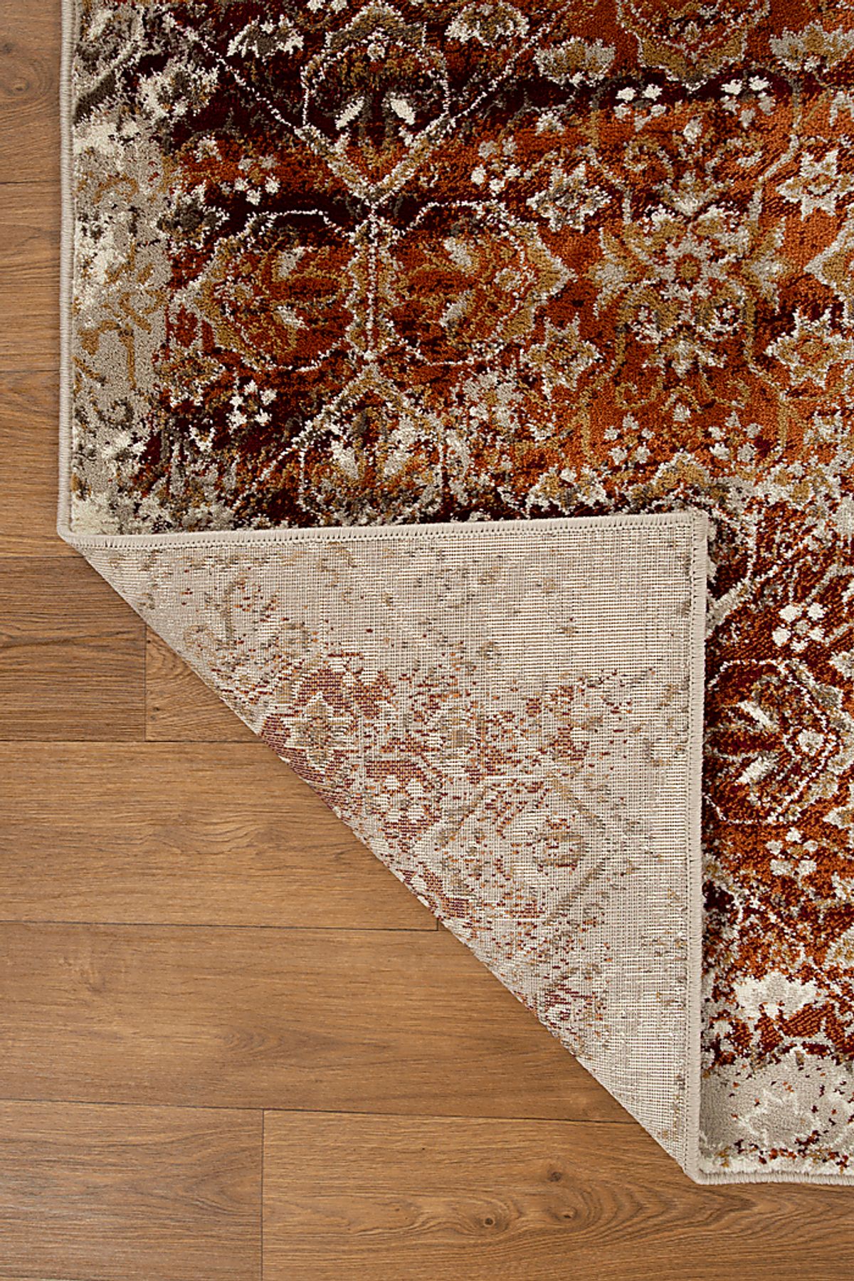 Dunnora Ivory,Rust Beige,Red Rugs | Rooms to Go