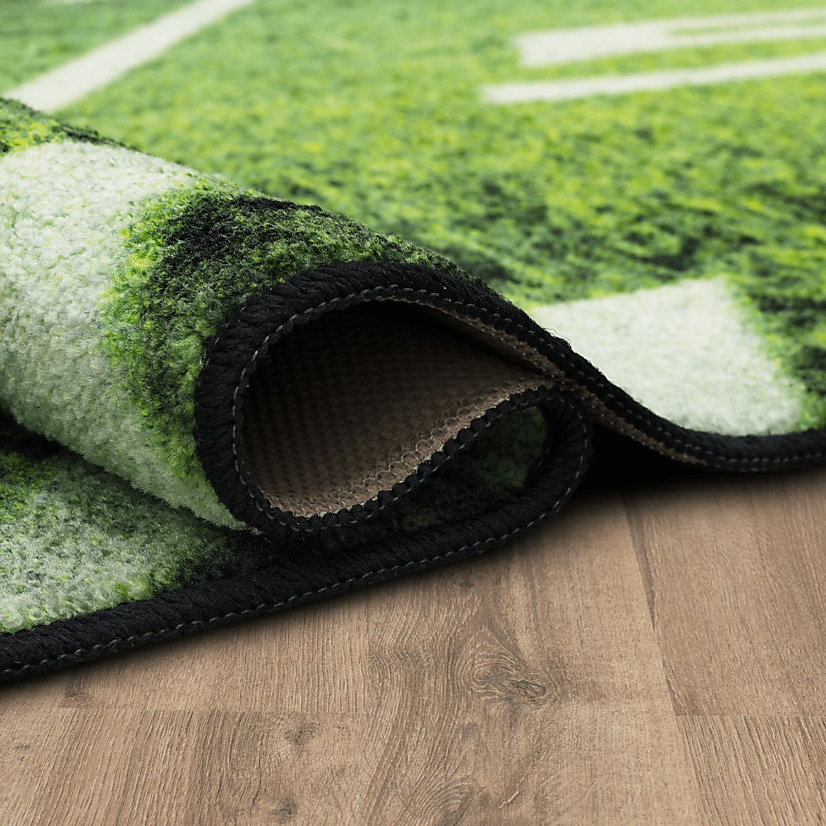 Stadium Stars Green,Multi Polyester Fabric Rug | Rooms to Go