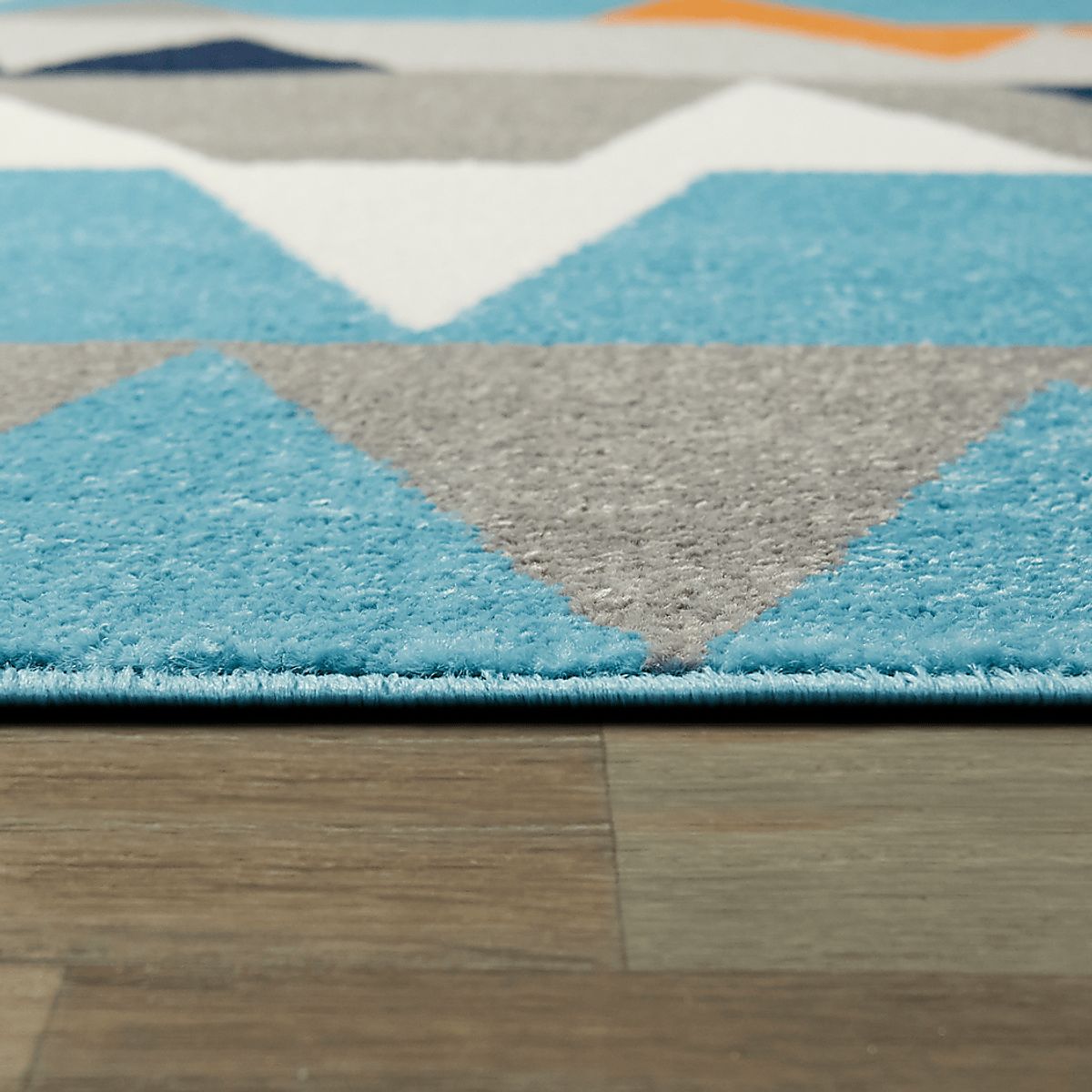 Wild Angles Blue Polypropylene Fabric Rug | Rooms to Go