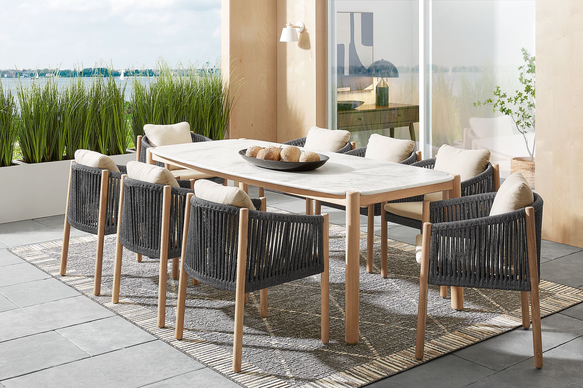 Koda Natural 9 Pc Outdoor Dining Set with Charcoal Arm Chairs - Image 1