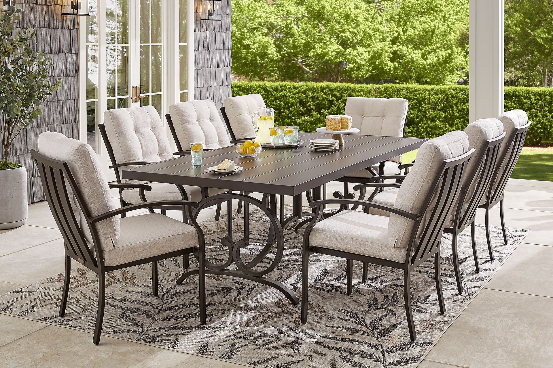 Lake Breeze Aged Bronze 9 Pc Outdoor 90 in. Rectangle Dining Set with Parchment Cushions - Image 1