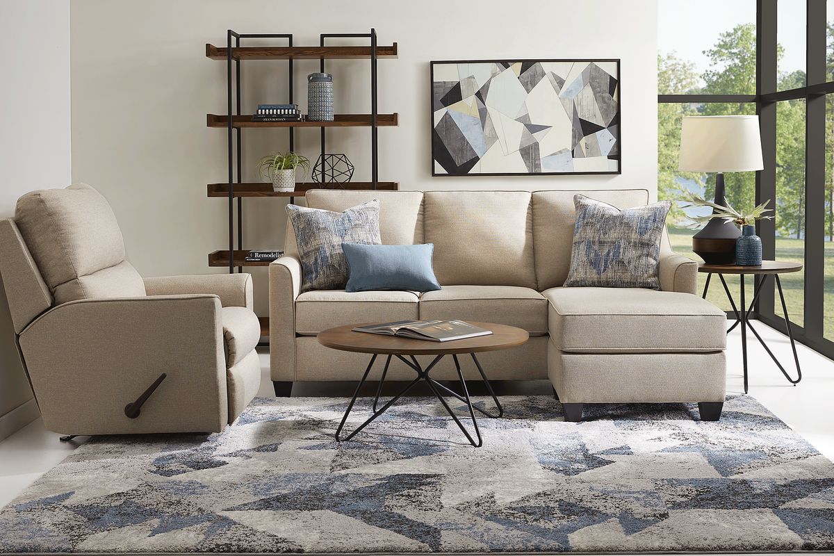 Neutral tan sofa with blue-grey and celery green throw pillows