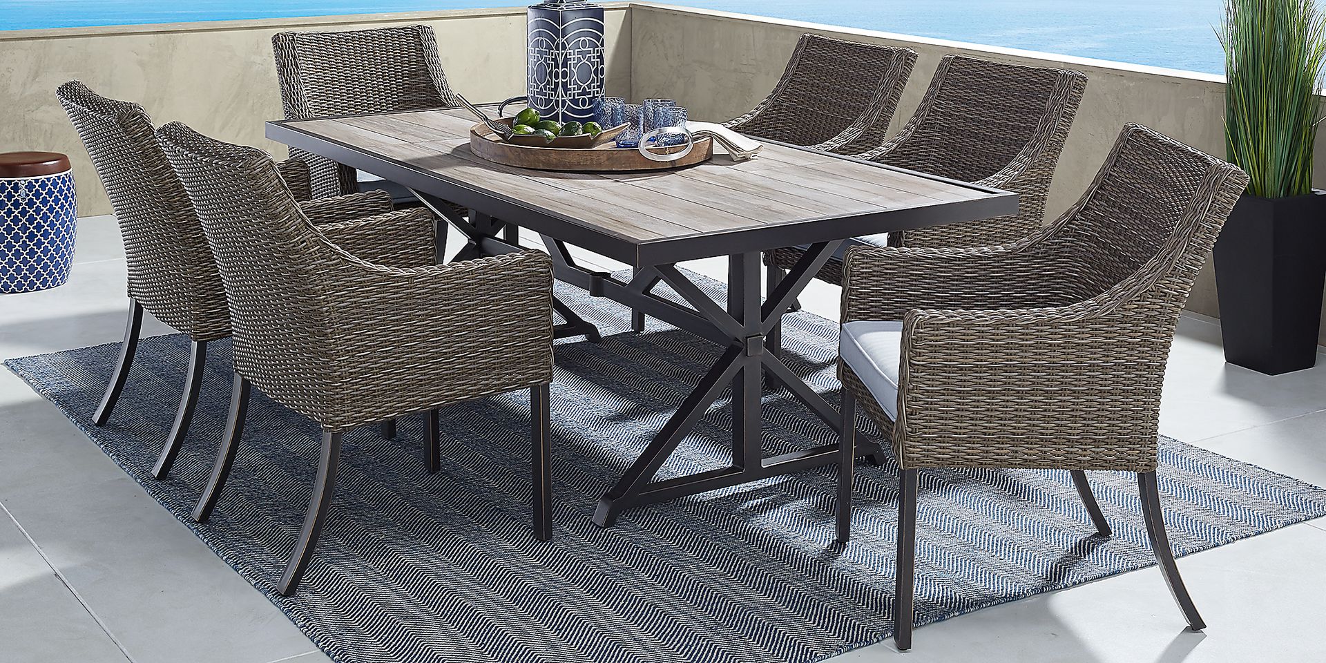 Oak Park Brown-Gray 7 Pc Outdoor Dining Set with Blue Cushions - Image 1