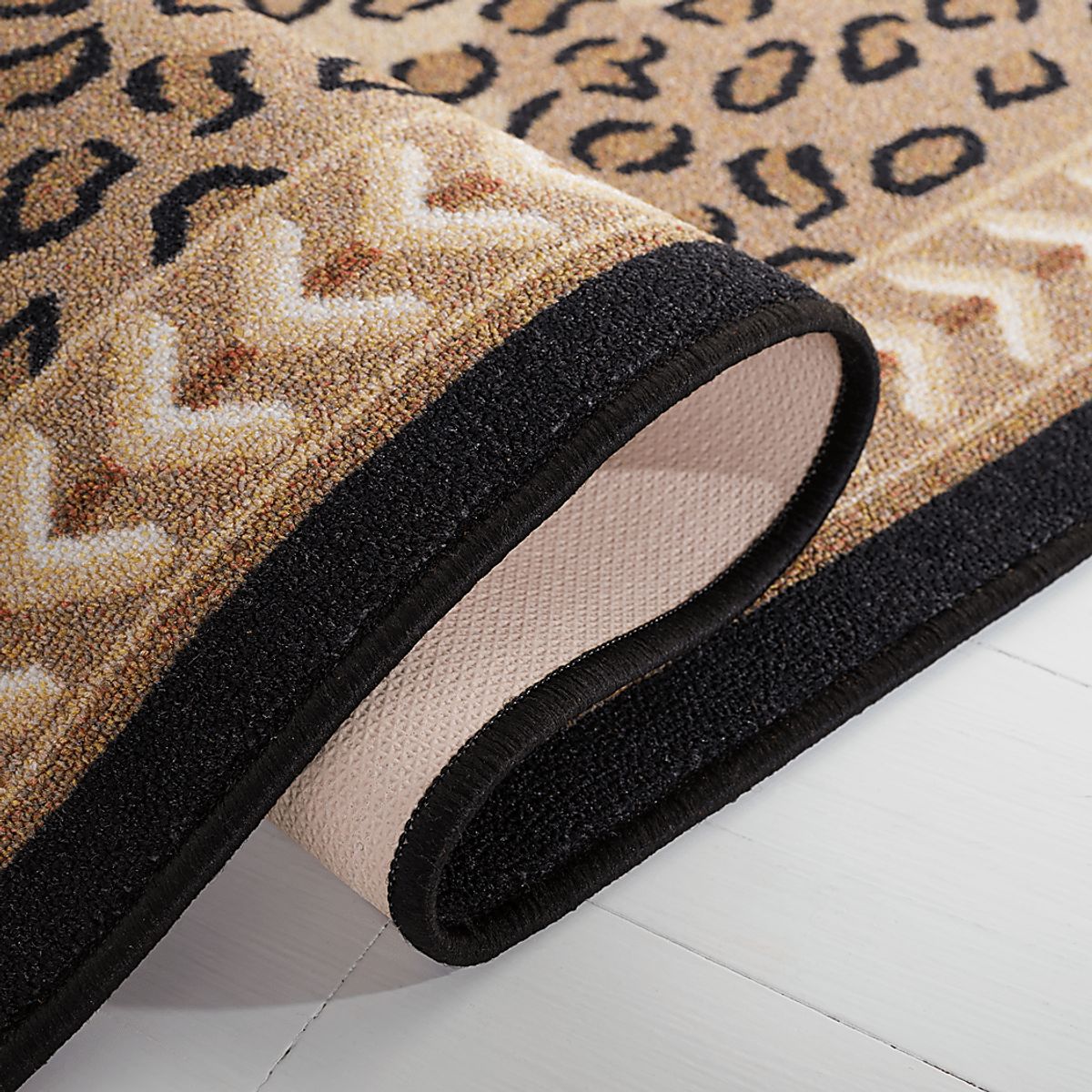 Oguvo Beige,Black Rugs | Rooms to Go