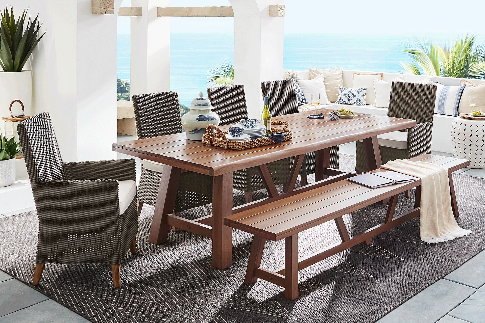 Patmos Tan 7 Pc 102 in. Rectangle Outdoor Dining Set With Linen Cushions and Bench - Image 1