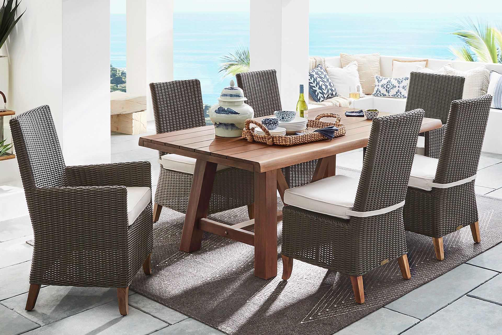 Patmos Tan 7 Pc 102 in. Rectangle Outdoor Dining Set With Linen Cushions - Image 1