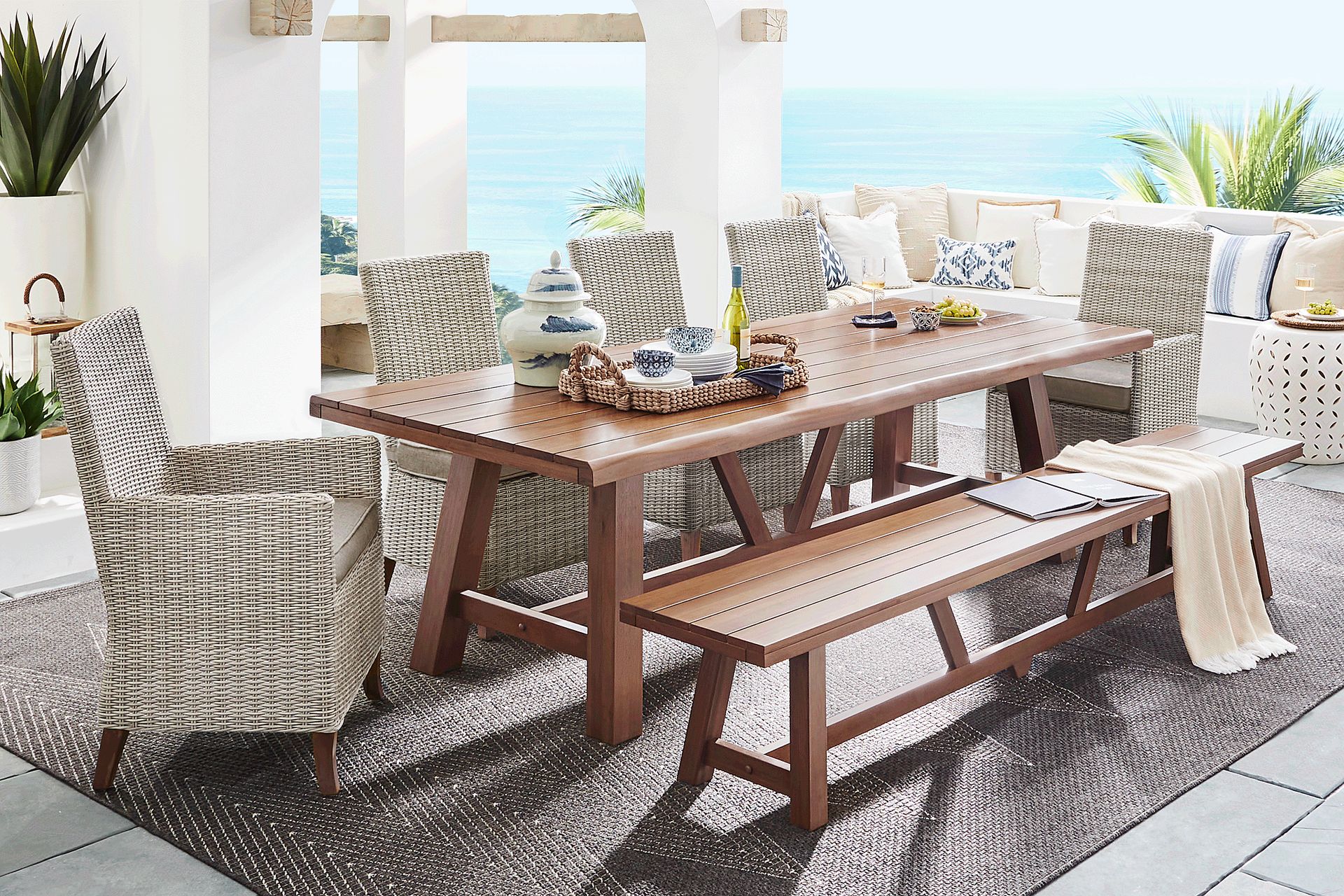 Patmos Tan 7 Pc 102 in. Rectangle Outdoor Dining Set With Mushroom Cushions and Bench - Image 1