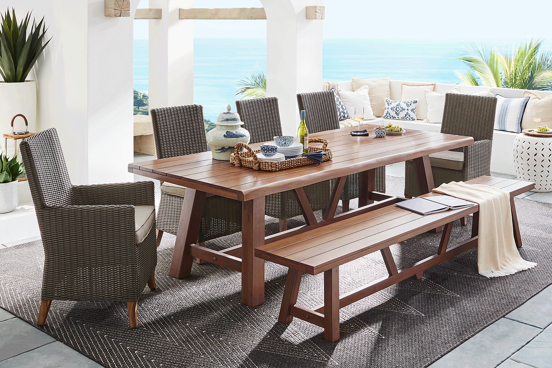 Patmos Tan 7 Pc 102 in. Rectangle Outdoor Dining Set With Mushroom Cushions and Bench - Image 1