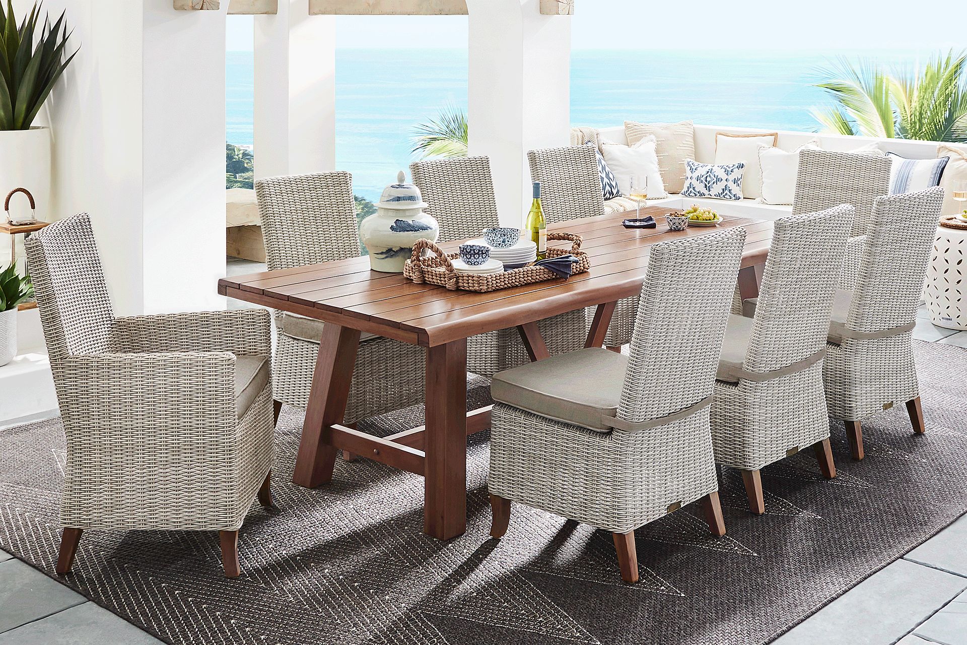 Patmos Tan 7 Pc 102 in. Rectangle Outdoor Dining Set With Mushroom Cushions - Image 1