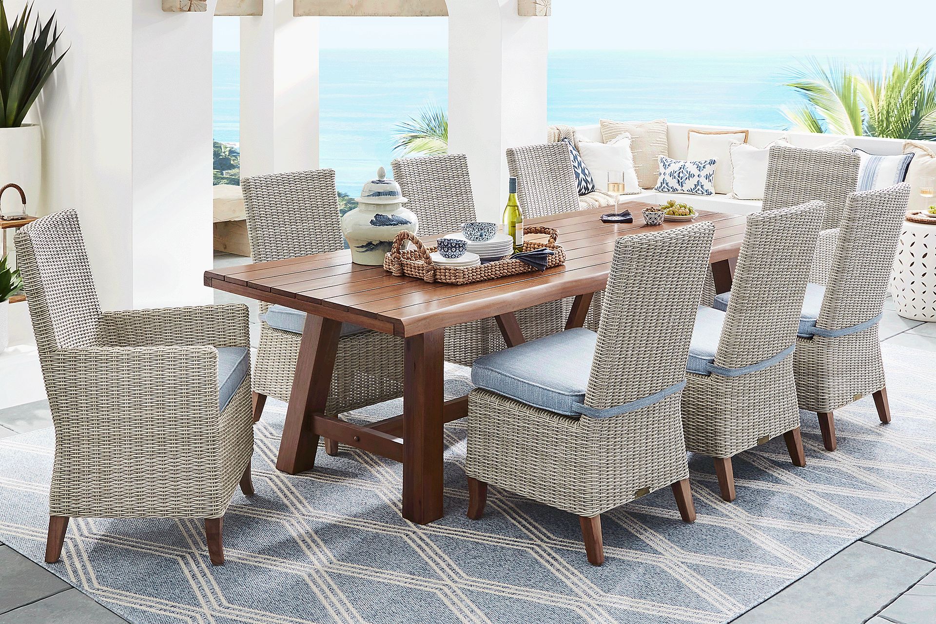 Patmos Tan 7 Pc 102 in. Rectangle Outdoor Dining Set With Steel Cushions - Image 1