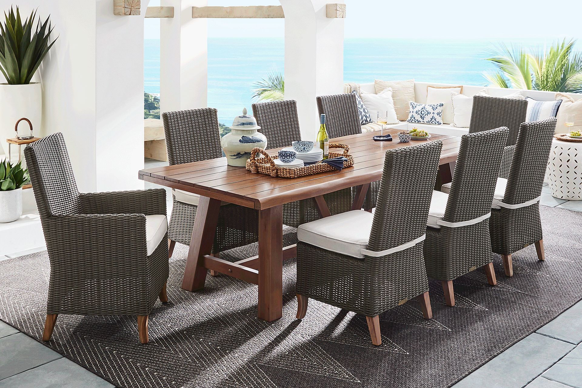 Patmos Tan 9 Pc 102 in. Rectangle Outdoor Dining Set With Linen Cushions - Image 1