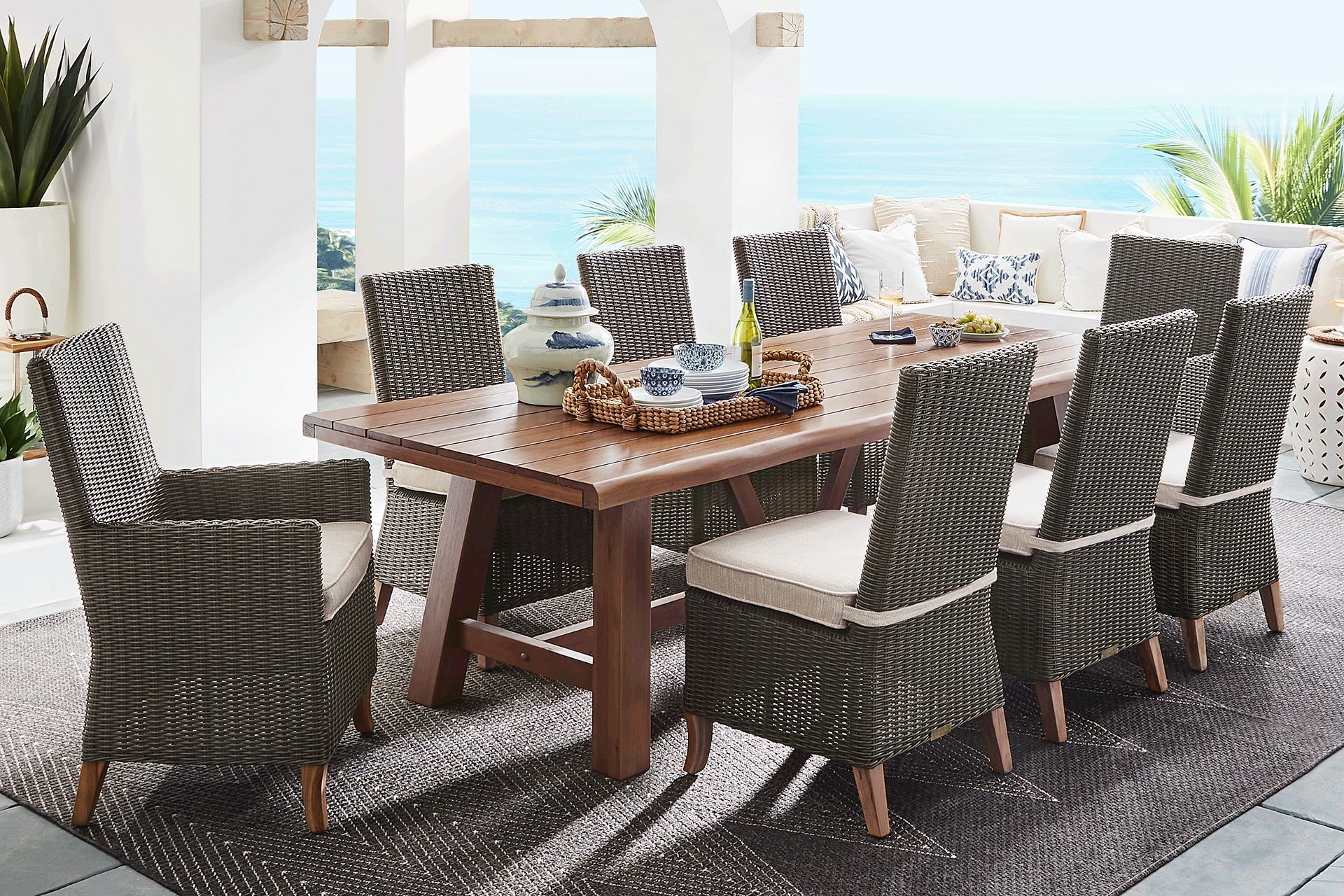 Patmos Tan 9 Pc 102 in. Rectangle Outdoor Dining Set With Twine Cushions - Image 1