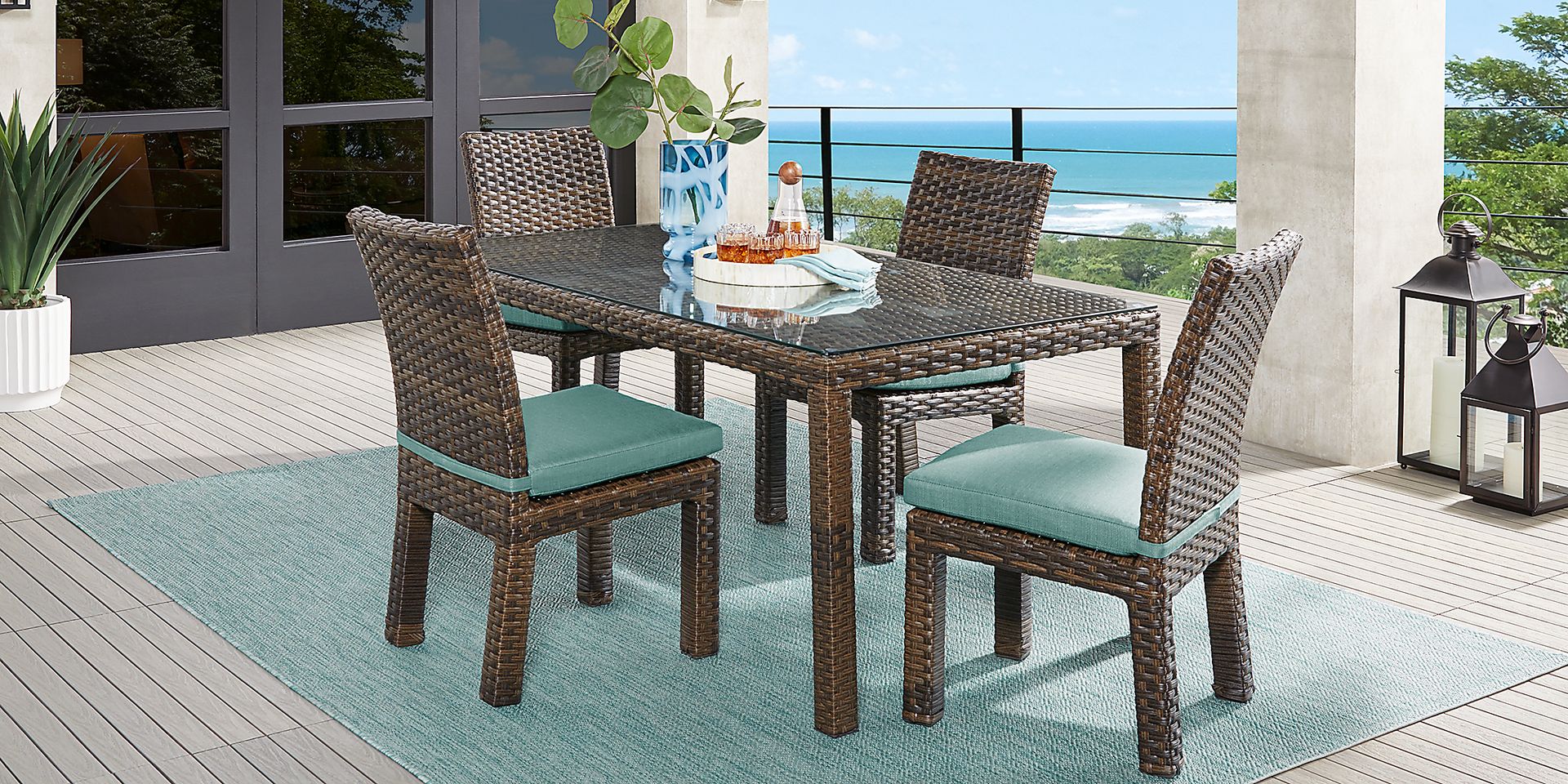 Rialto Brown 5 Pc 72 in. Rectangle Outdoor Dining Set with Aqua Cushions - Image 1