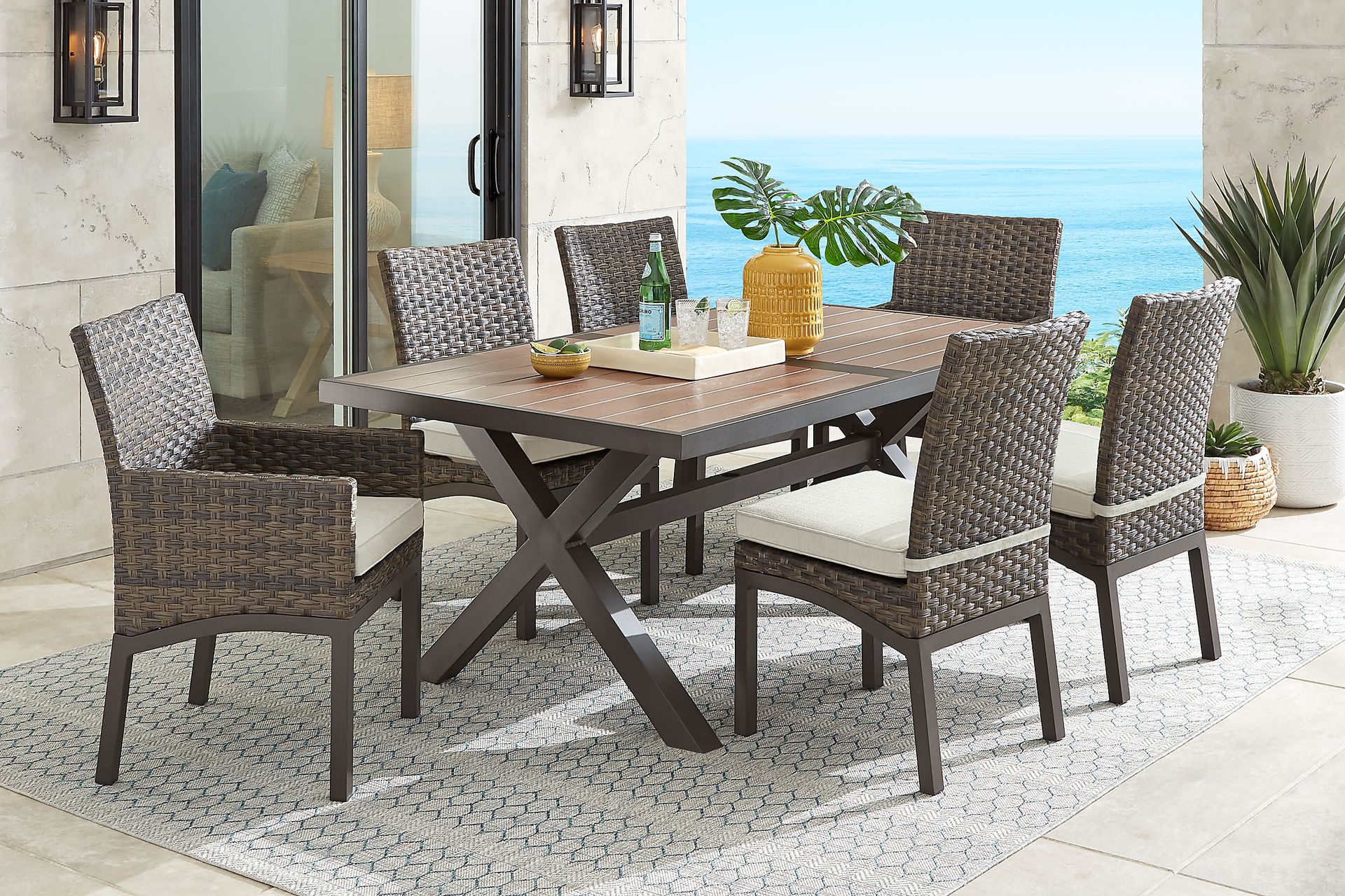 Rialto Brown 7 Pc 71 in. Rectangle Outdoor Dining Set with Putty Cushions - Image 1