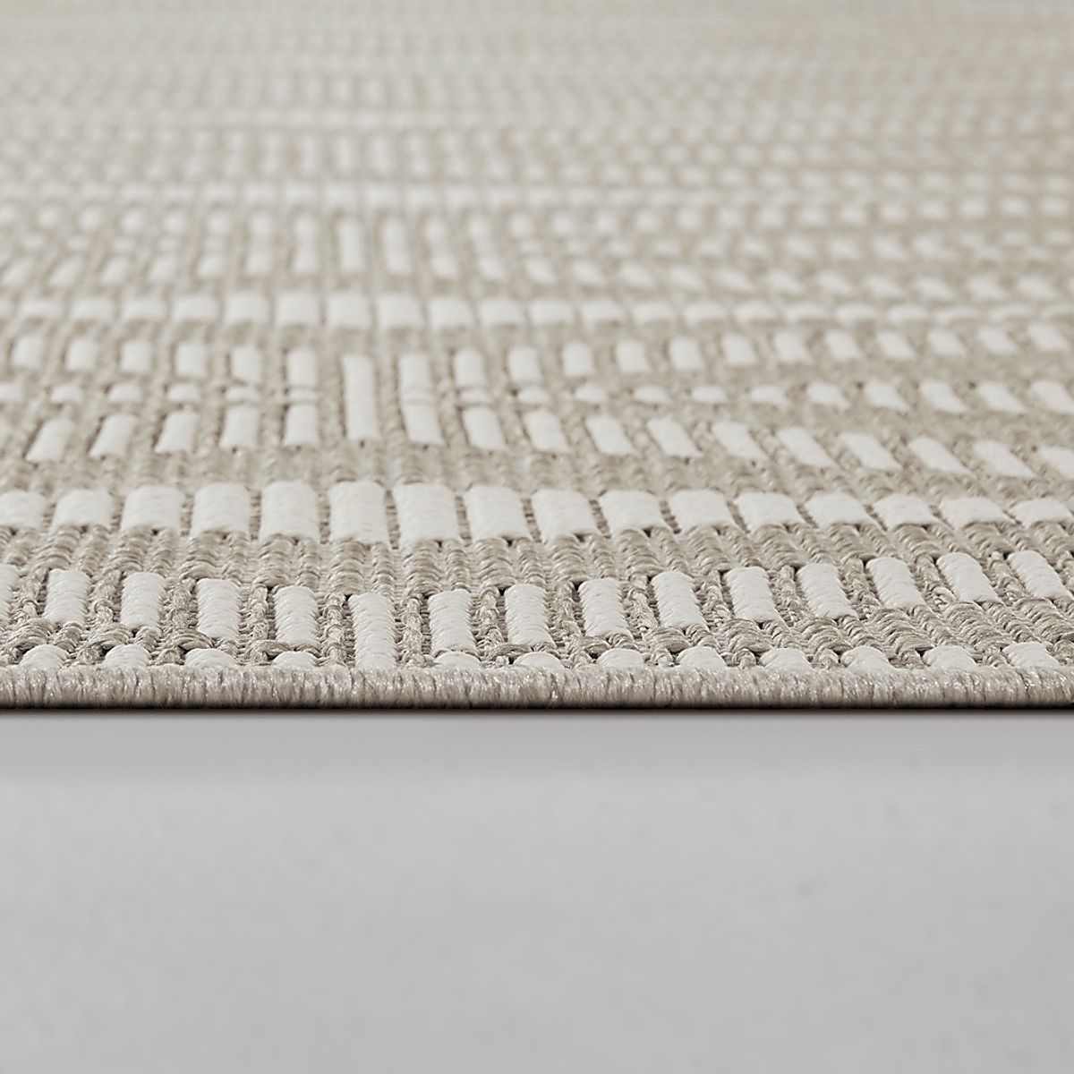 Sawtelle Taupe Beige Polypropylene Fabric Outdoor Rug | Rooms to Go