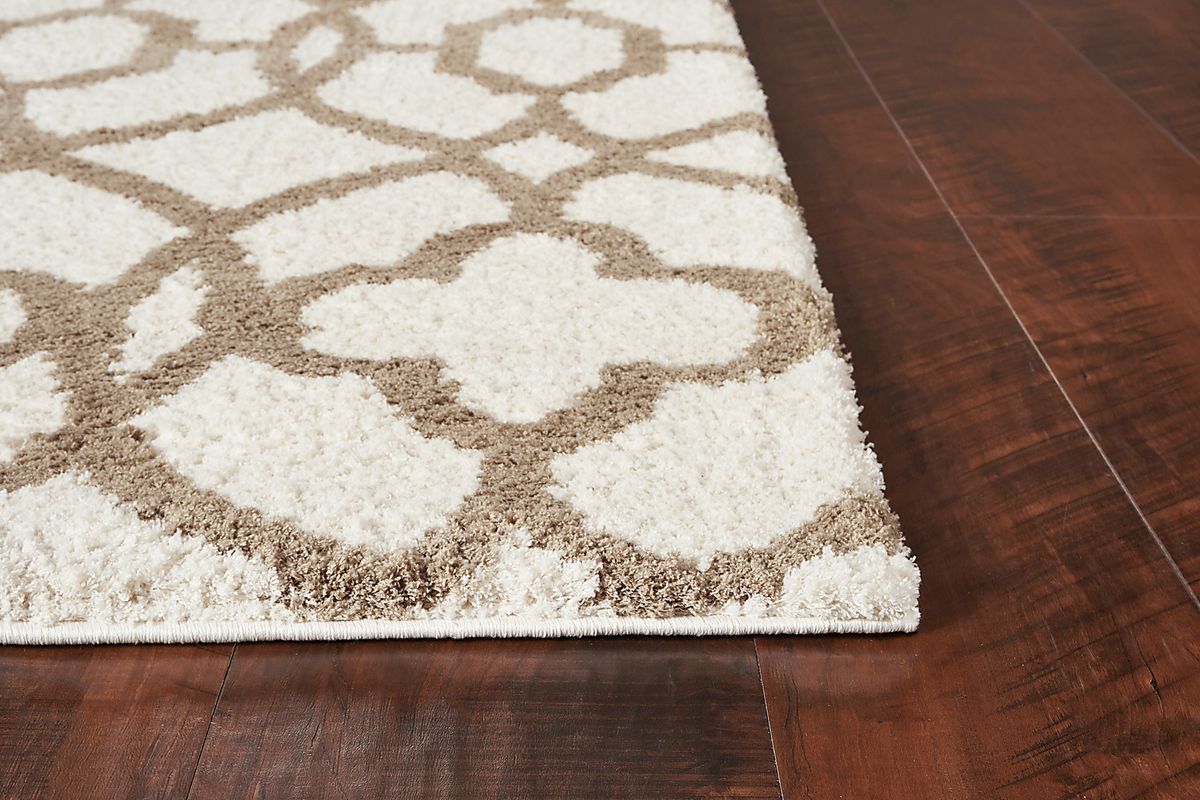 Shelnola Beige,Ivory Beige Rugs | Rooms to Go