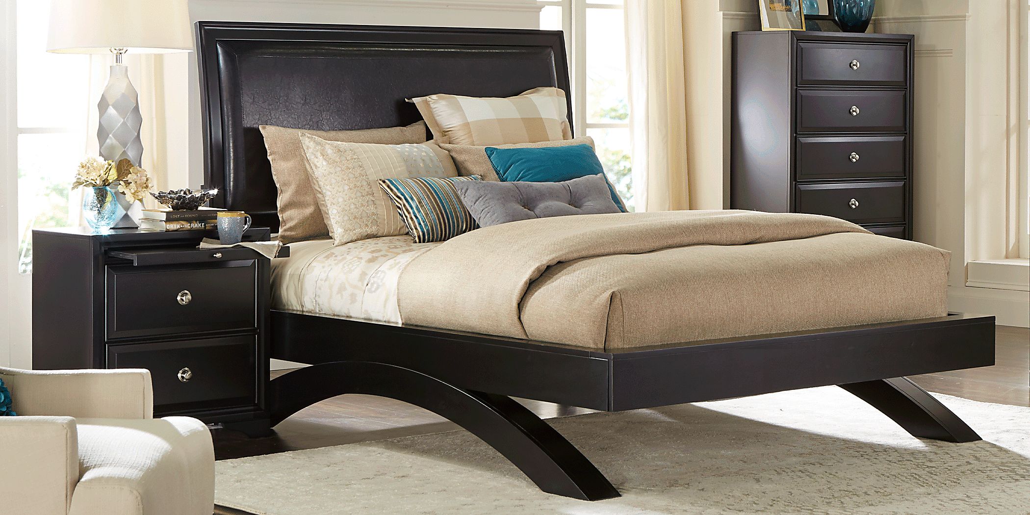 https://assets.roomstogo.com/product/small-spaces-belcourt-black-5-pc-queen-upholstered-sleigh-arch-bedroom_8325544P_image-room?cache-id=e2eb4119886c06cfdb6921db10a7a02d
