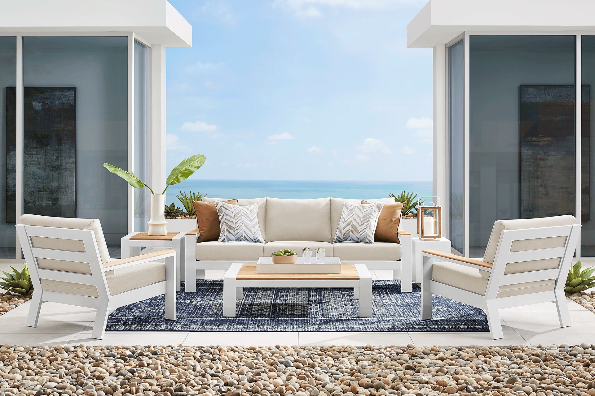 Solana White 4 Pc Outdoor Sofa Seating Set With Buff Cushions - Image 1