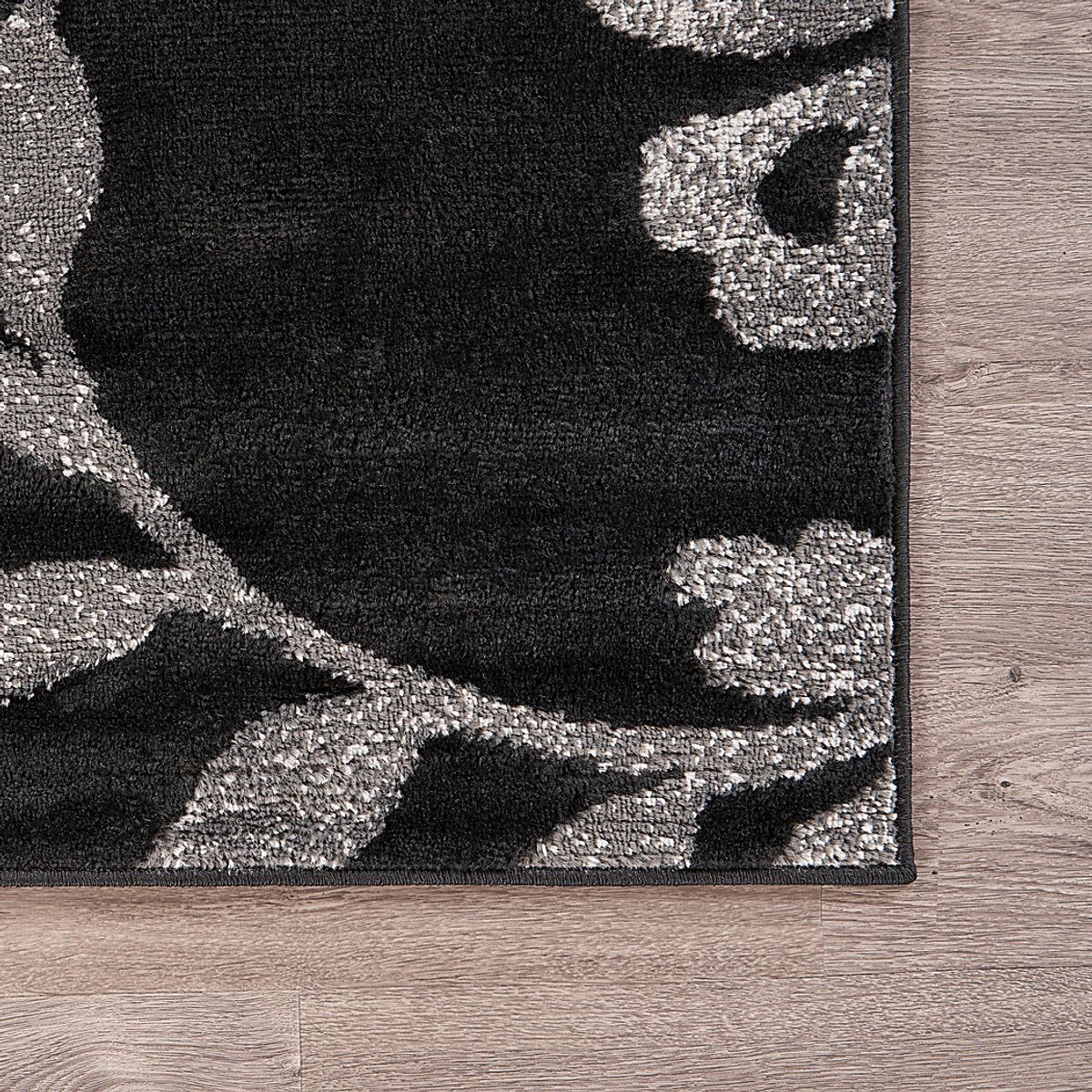 Storleah Black Rug | Rooms to Go