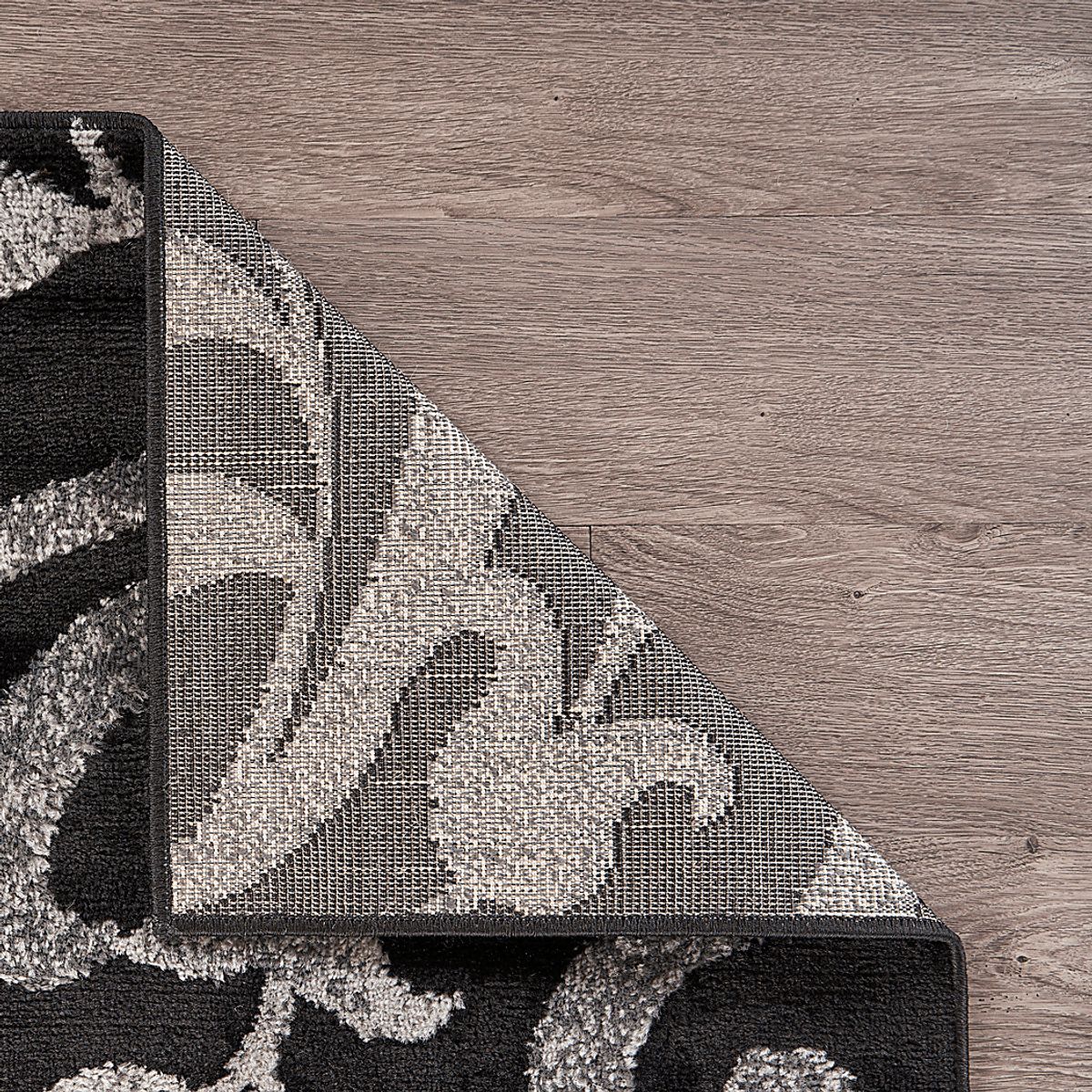 Storleah Black Rug | Rooms to Go