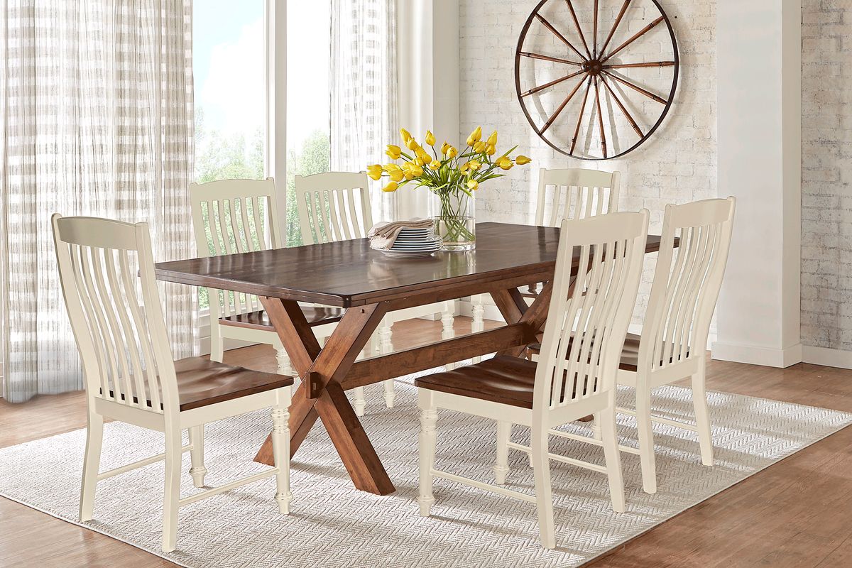 Brown dining table with white deals chairs