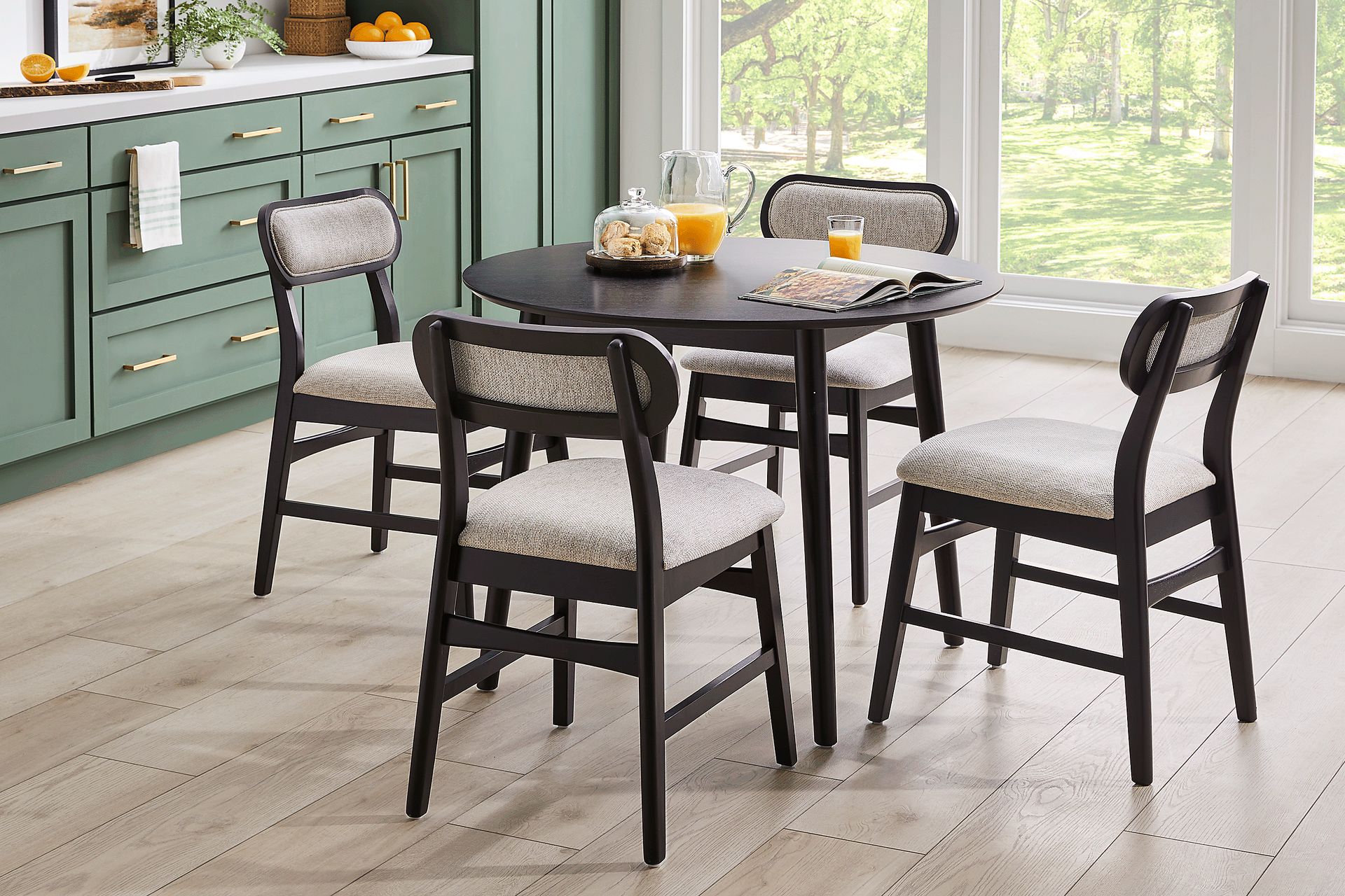 Watertown Black 5 Pc Round Dining Room with Upholstered Chairs - Image 1