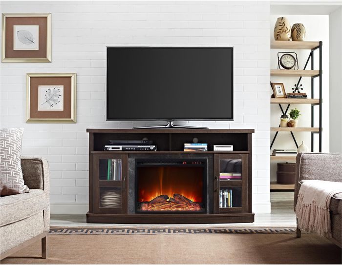 decorated dark wood tv console with electric fireplace