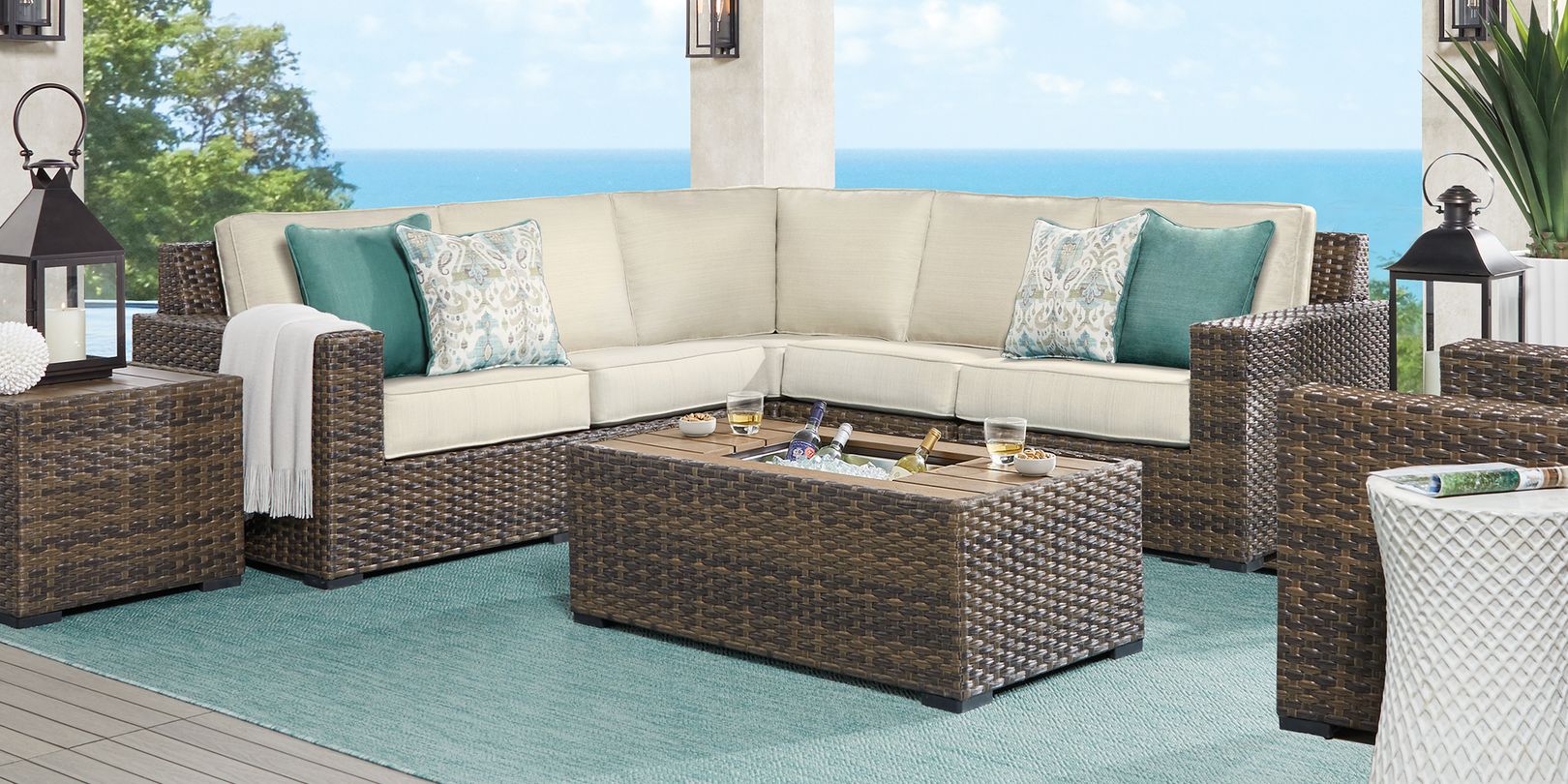 Photo of brown wicker sectional and fire pit table