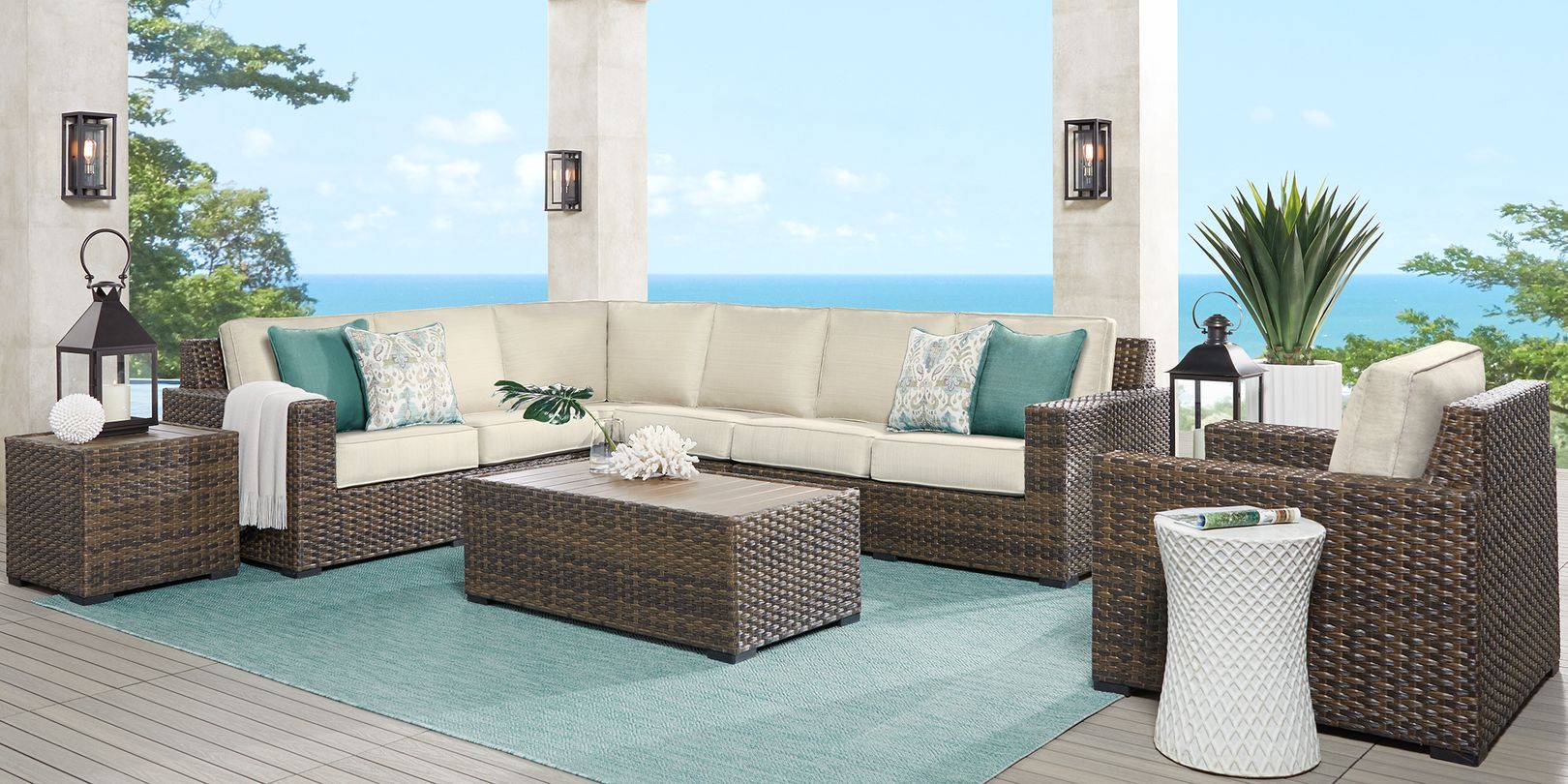 Photo of a brown wicker patio seating set with putty colored cushions