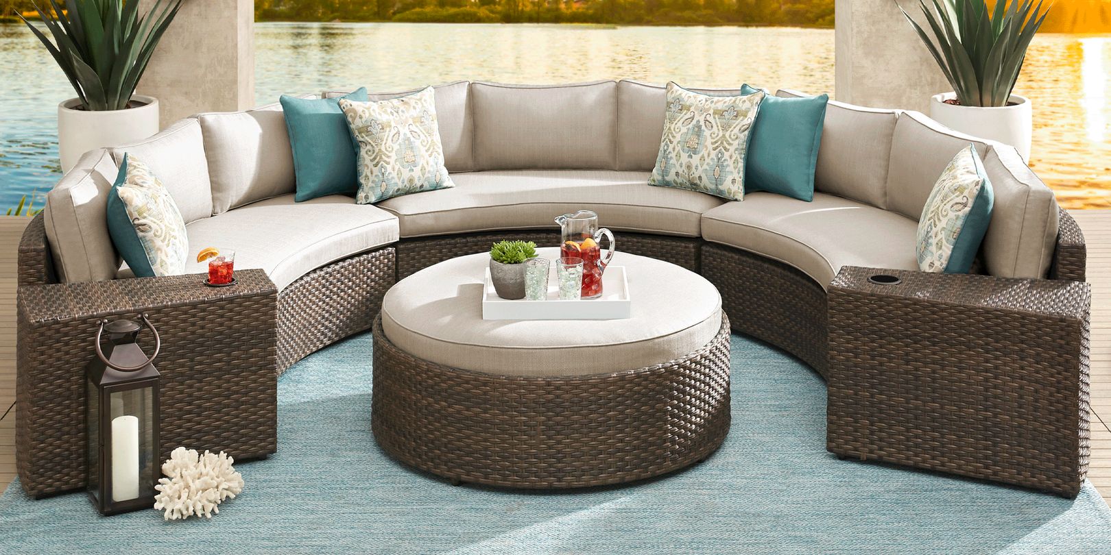 photo of modular curved brown wicker sectional with tan cushions and ottoman
