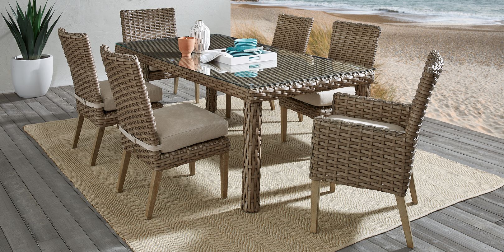 Beige rug with wicker dining set