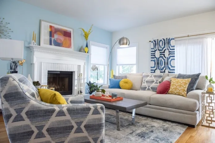 Living room decorated with blue accents and modern prints
