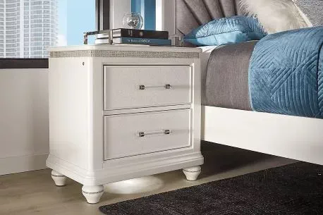 ivory nightstand with dark brown round handles 
