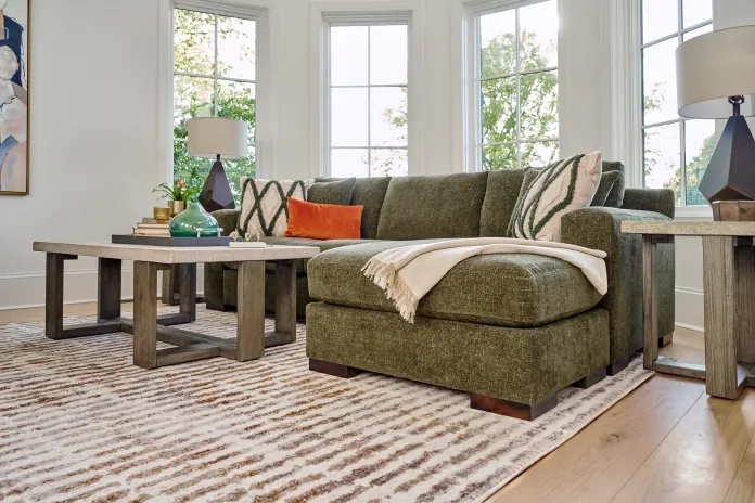 Olive green sofa decorated with earth tone elements