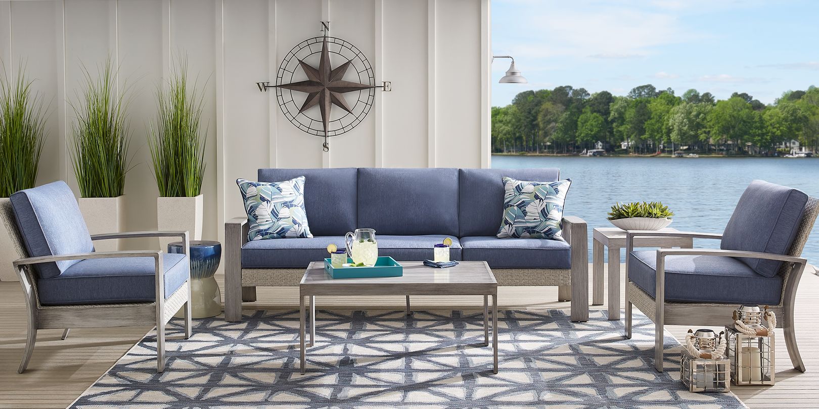 Photo of a gray wooden seating set with blue cushions