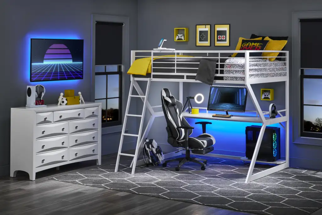 A modern gaming bedroom with a loft bed, desk, and dresser.
