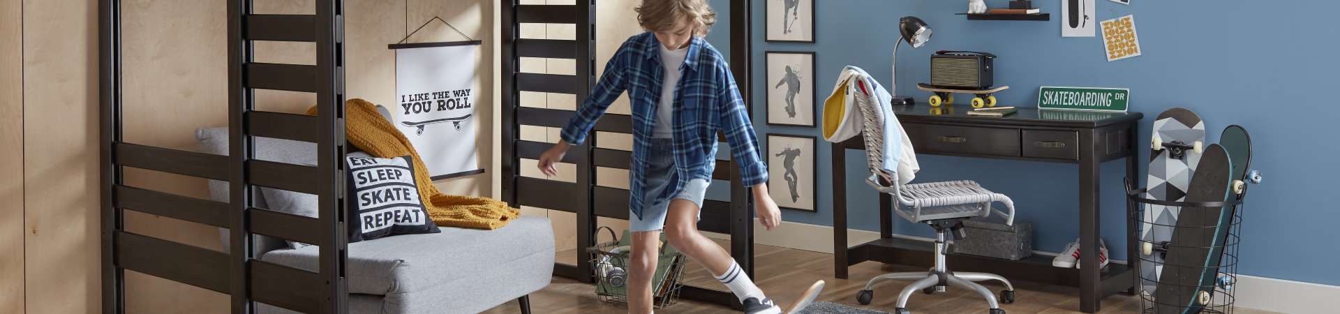 Teen boy practicing skateboarding in bedroom