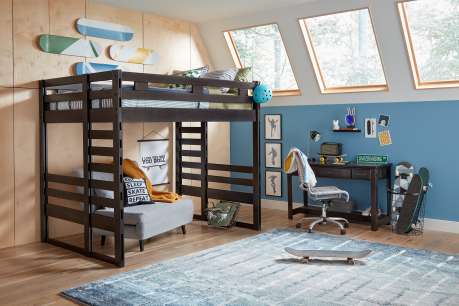A bedroom with a loft bed, desk, and skateboard decor.
