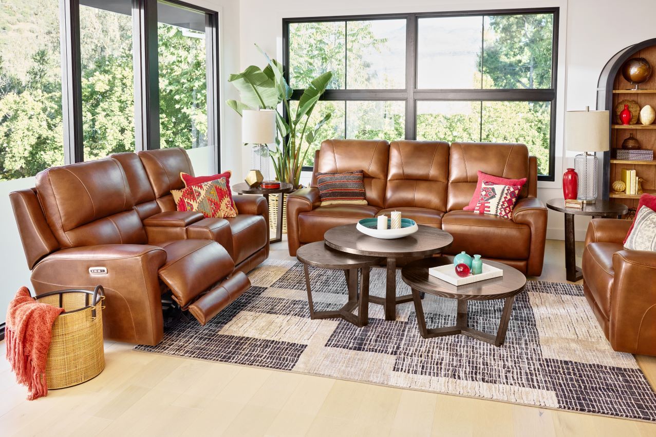 Brown leather reclining sofa and chairs in a living room.
