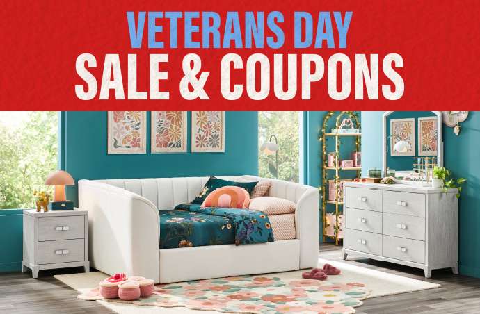 VETERANS DAY SALE & COUPONS. A bedroom with a white daybed, dresser, and nightstand.