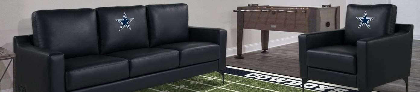 Black leather sofa and armchair with Dallas Cowboys logo.