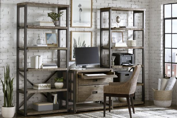 Wooden desk and shelving unit with a computer, printer, and chair.
