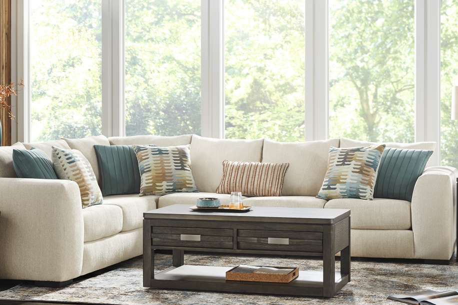 Beige sectional sofa with neutral pillows