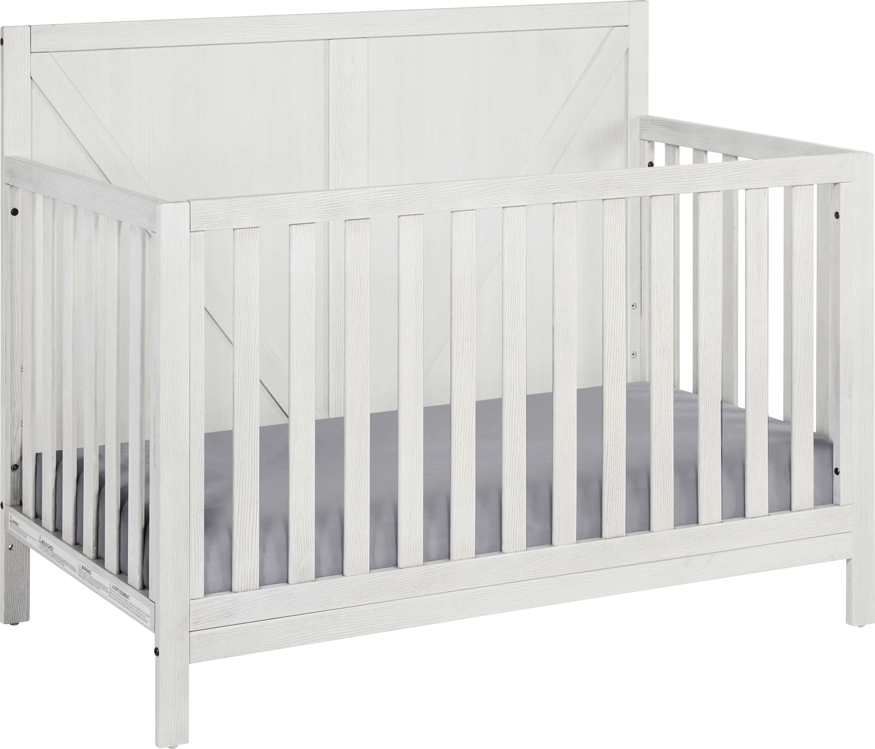 White wooden crib with vertical slats on the rail and headboard.